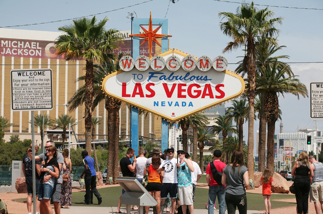 Las Vegas sign with people taking pictures